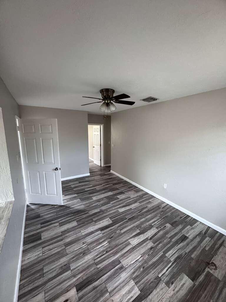 3309 Avenue South Riviera Beach, FL 33404 - Photo 4 of 17 a view of empty room with wooden floor