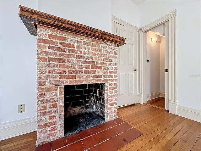 a kitchen with a refrigerator and a stove