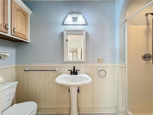a kitchen with granite countertop white cabinets stainless steel appliances and sink