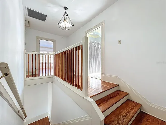 an aerial view of a house with a yard and garden