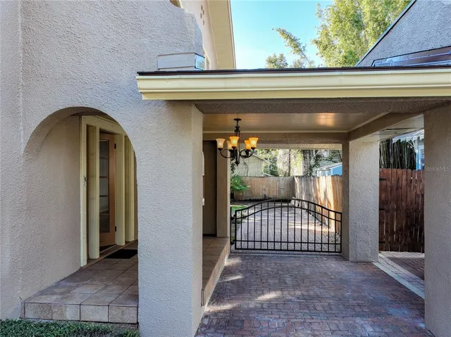 a view of a livingroom with wooden floor fireplace and staircase