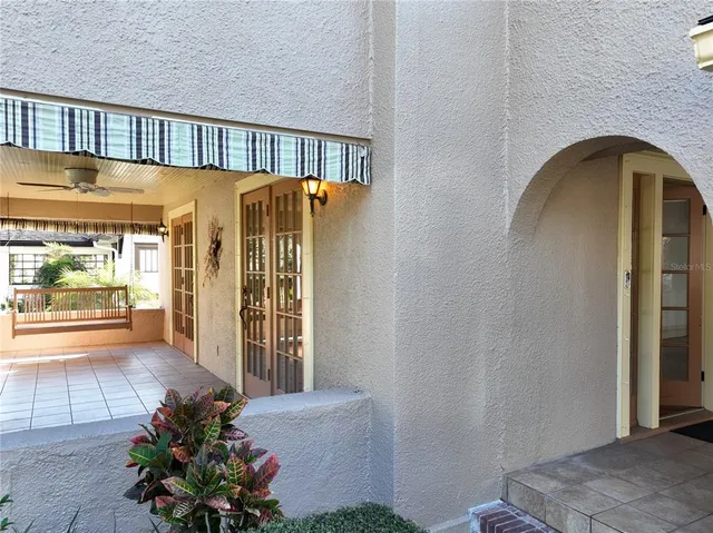 a living room with a furniture and a wooden floor
