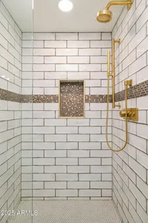 a bathroom with a bathtub and shower