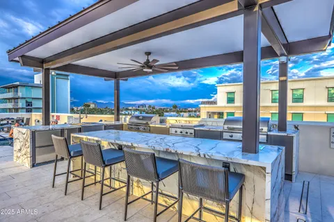 a dining table with chairs and window