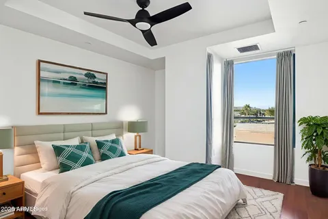 a bedroom with bed and a window