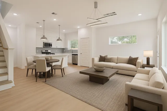 a large kitchen with cabinets and wooden floor