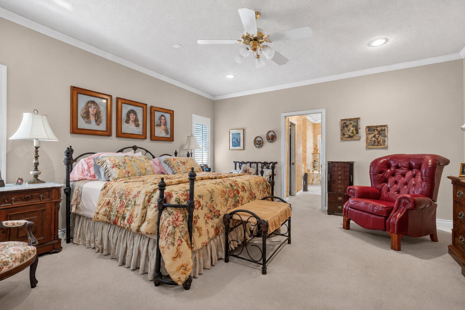 7402 95th Street Lubbock, TX 79424 - Photo 19 of 43 a spacious bedroom with double bed and a couch