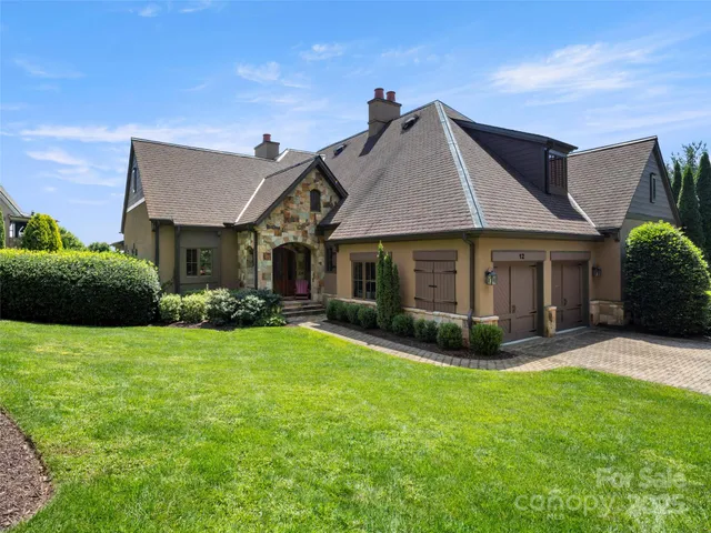 a front view of a house with a garden and porch