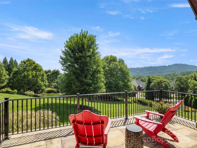 a view of a two chairs in the deck