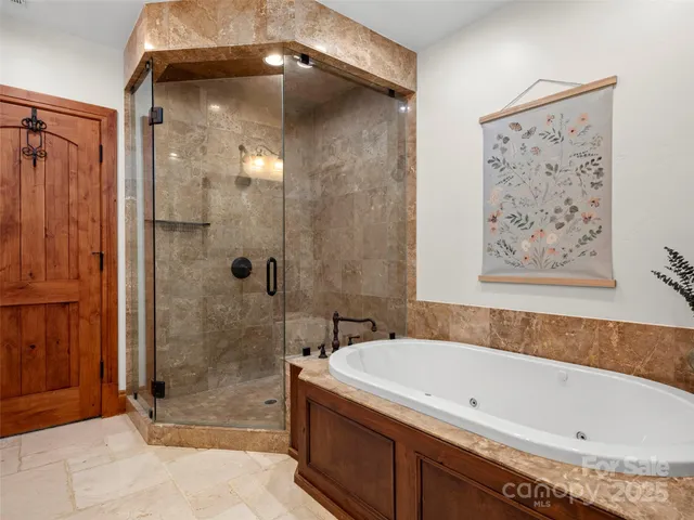 a bathroom with a tub and shower