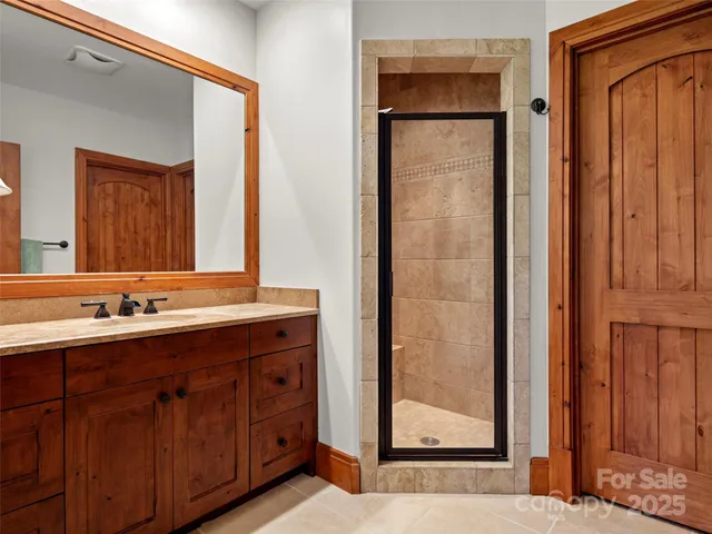 a bathroom with a double vanity sink and mirror