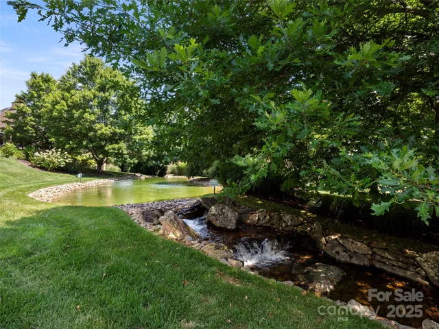 a view of a golf course with a lake