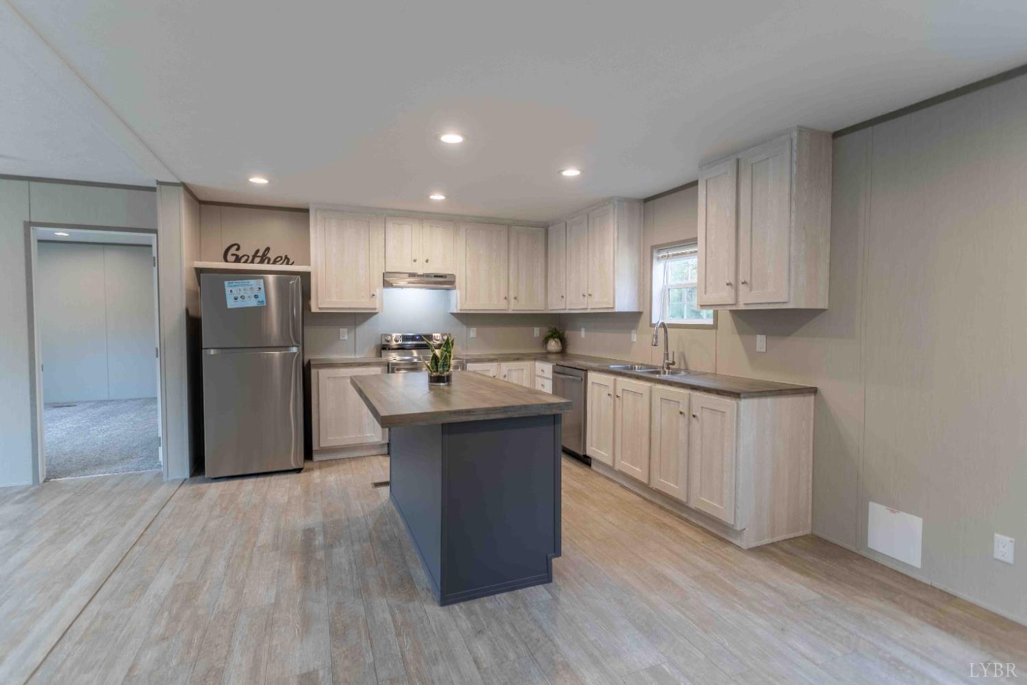 1007 Austin Road Gladstone, VA 24553 - Photo 12 of 35 a kitchen with stainless steel appliances granite countertop a refrigerator sink and cabinets
