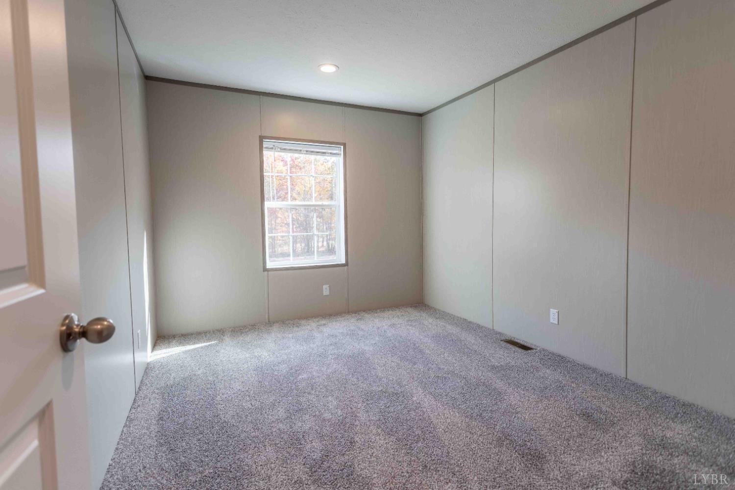 1007 Austin Road Gladstone, VA 24553 - Photo 19 of 35 an empty room with windows