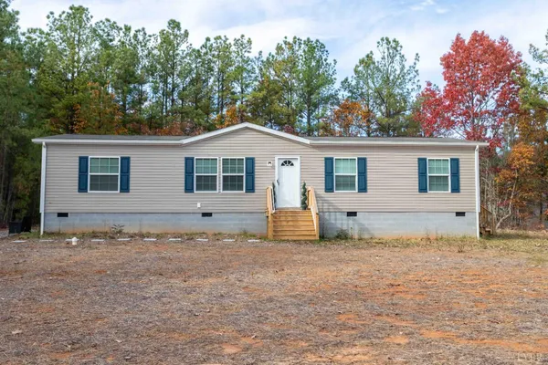 a house with trees in the background