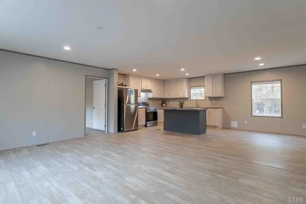 a view of kitchen with wooden floor