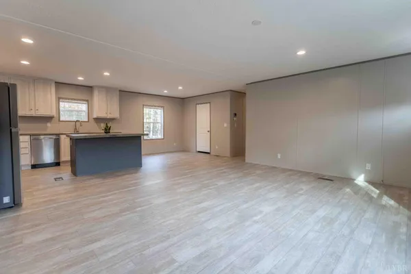 a view of a kitchen with a sink and a refrigerator