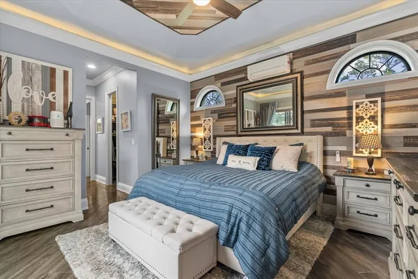 a bedroom with a bed and a dresser