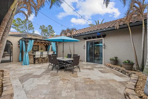 a view of a dinning table and chairs in patio