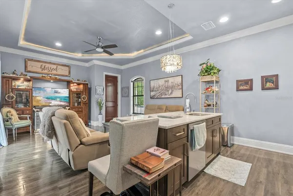 a living room with fireplace furniture and a wooden floor