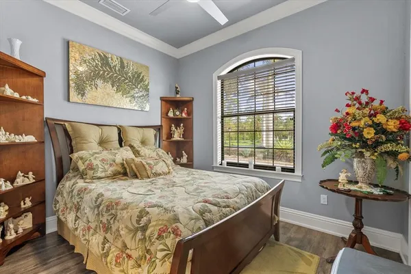 a bedroom with bed and a window