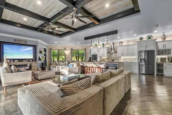 a living room with lots of furniture and a flat screen tv