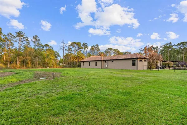 a view of a house with a big yard