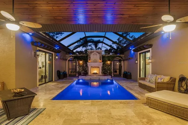 a room with pool table and windows