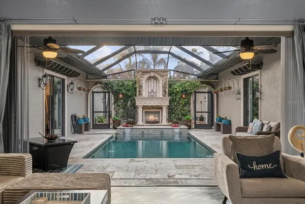 a view of a living room and kitchen with furniture