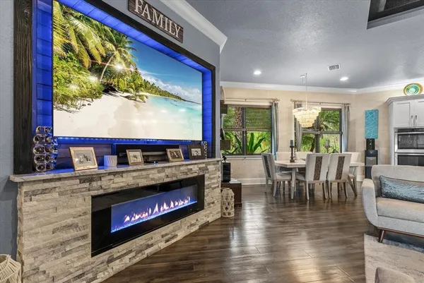 a living room with fireplace furniture and a flat screen tv
