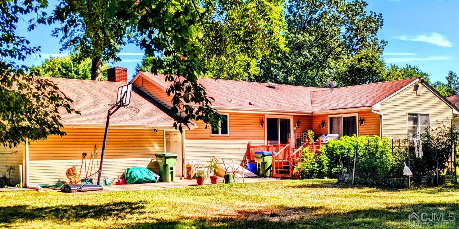 25 Parker Road Edison, NJ 08820 - Photo 2 of 9 a view of a house with a swimming pool