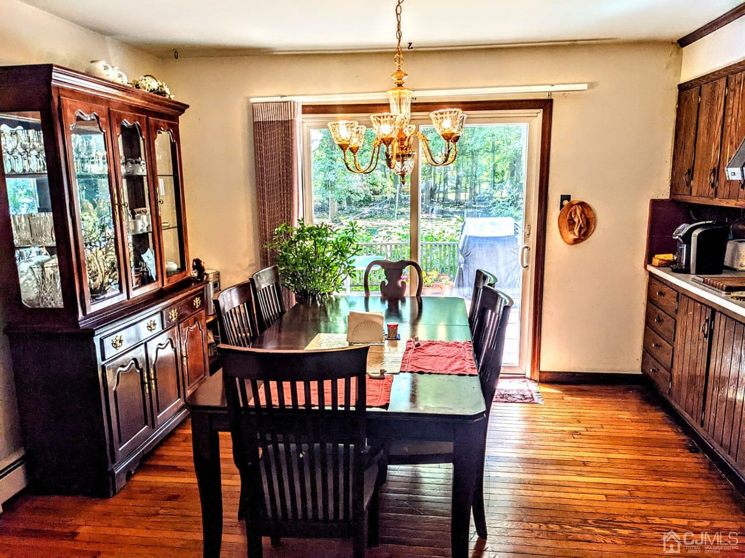 25 Parker Road Edison, NJ 08820 - Photo 6 of 9 a view of a dining room with furniture window and wooden floor