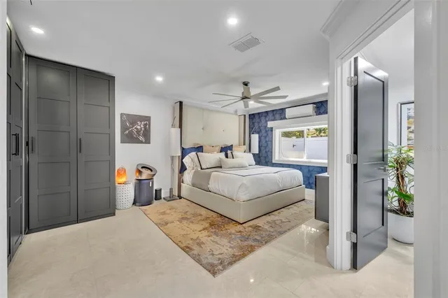 a large kitchen with a large counter top appliances and cabinets