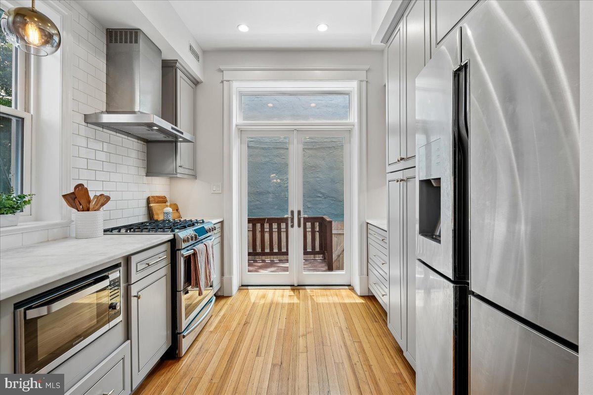 1105 G Street Southeast Washington, DC 20003 - Photo 24 of 51 Kitchen opens onto rear deck and patio