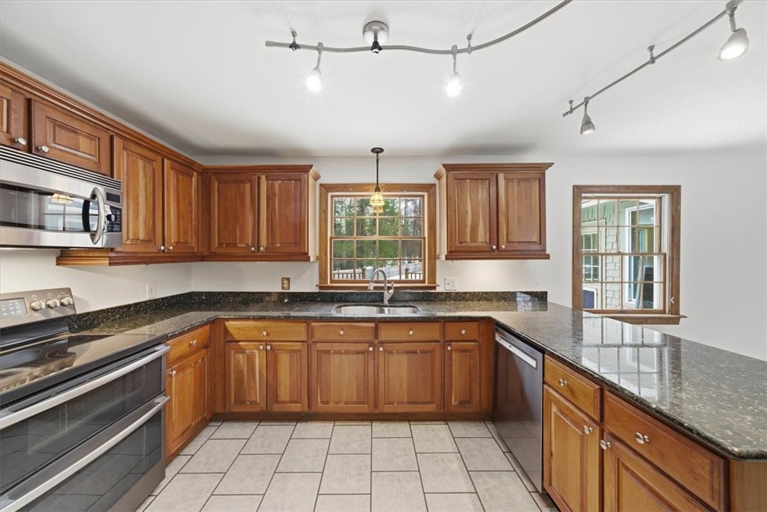 449 Widow Sweets Road Exeter, RI 02822 - Photo 16 of 50 Generous kitchen with solid cherry cabinets, granite counters and SS appliances