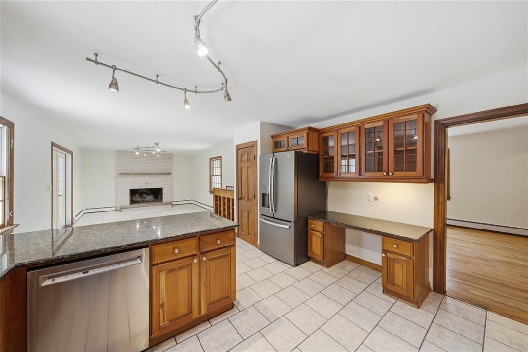 449 Widow Sweets Road Exeter, RI 02822 - Photo 20 of 50 View of kitchen showing dining room entrance and built in desk area