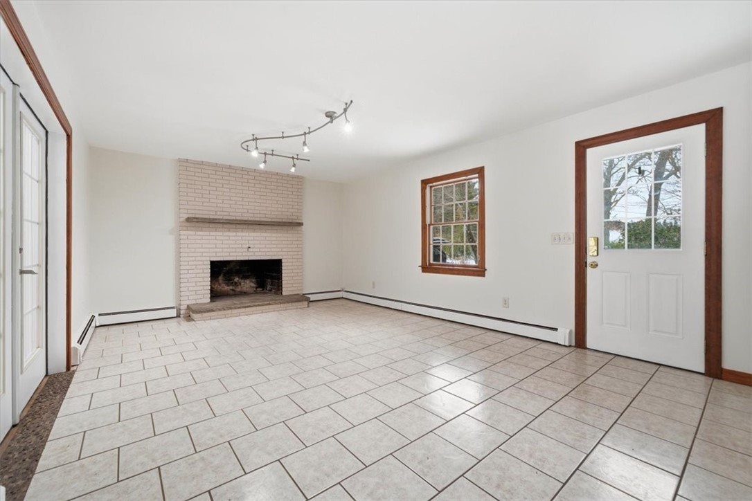 449 Widow Sweets Road Exeter, RI 02822 - Photo 21 of 50 Giant family room with wood-burning fireplace (exit to the porch or sunroom)
