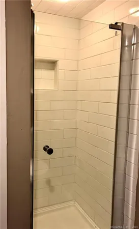 a bedroom with a bed and a fireplace