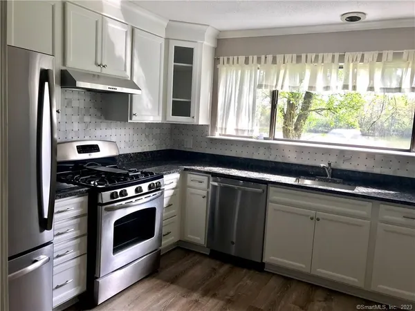 a view of a yard with an outdoor space