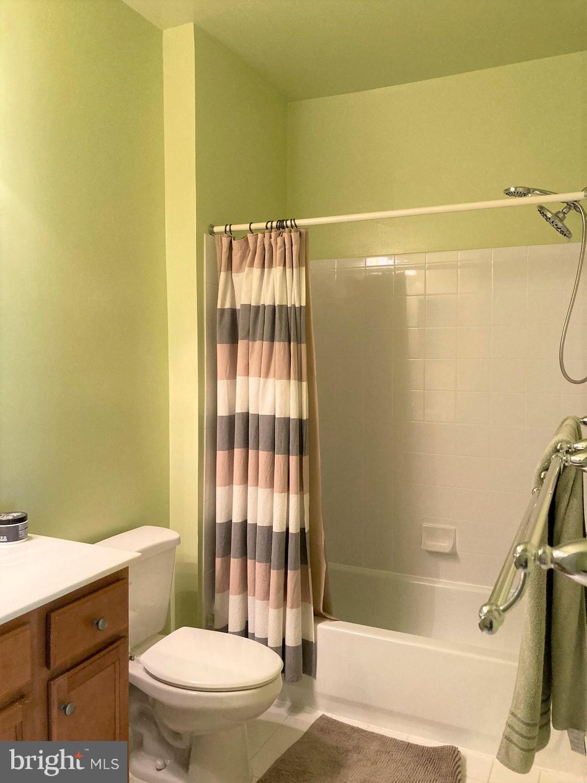 1509 North Point Drive, Unit 303 Reston, VA 20194 - Photo 12 of 30 WILL BE PAINTED NEUTRAL - Large ensuite bathroom