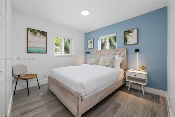 a bedroom with a bed and a chair