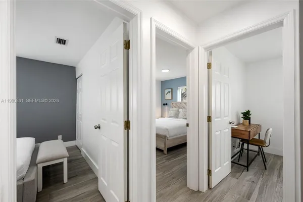 a view of room with lounge chair and wooden floor