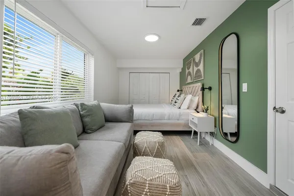 a bed room with a bed and a couch