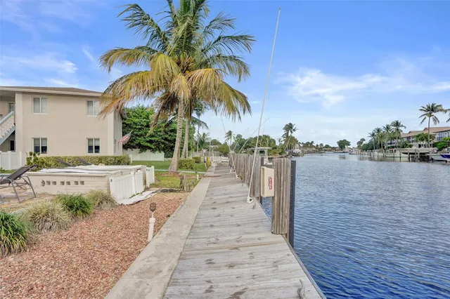 a front view of a house with a lake view