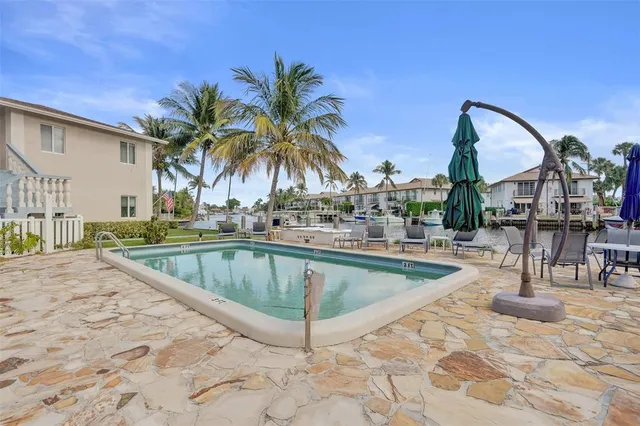 a view of a swimming pool with a lounge chairs