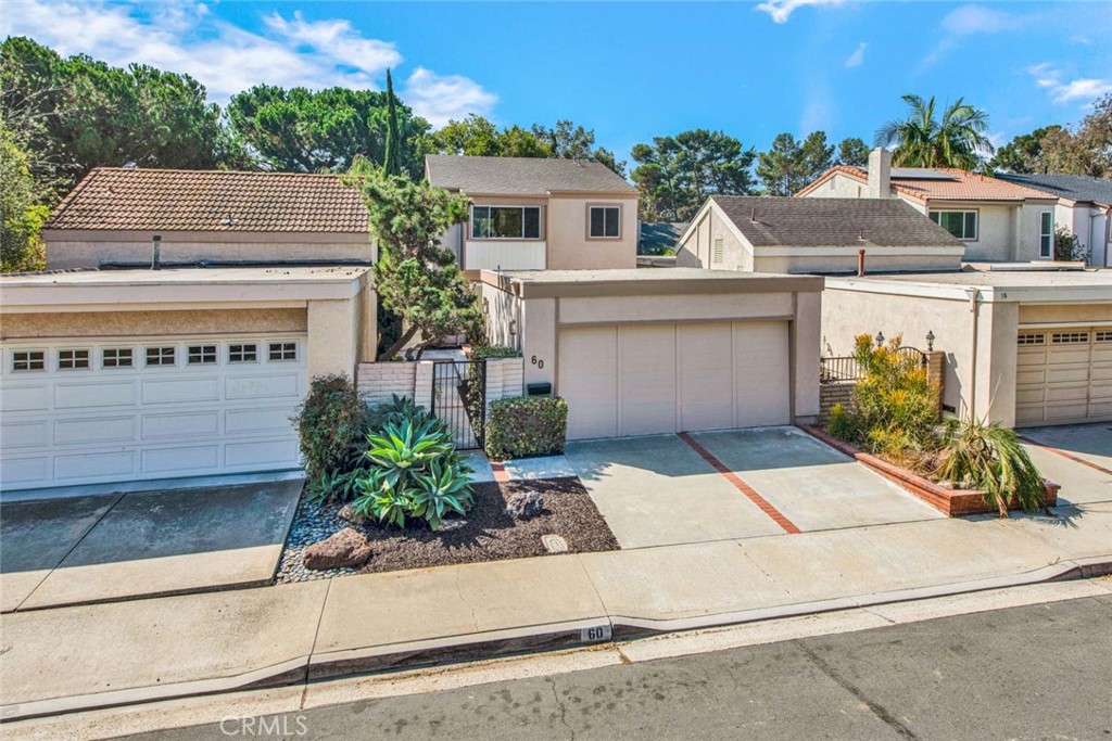 a front view of a house with a yard and a garage