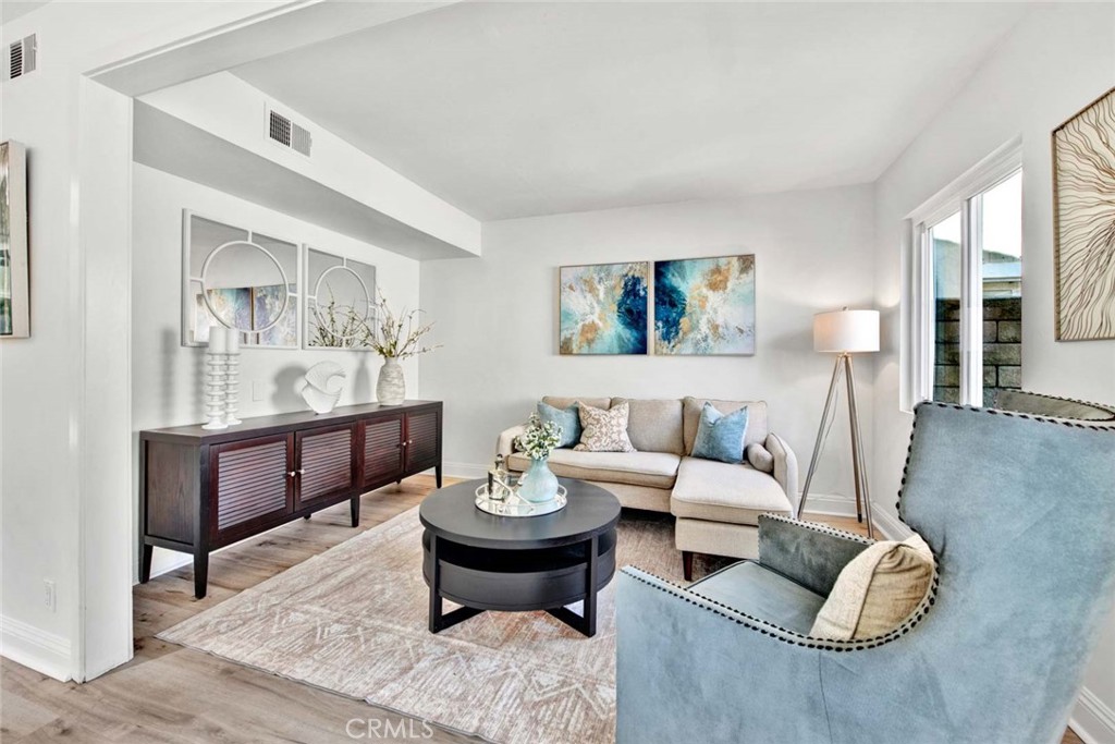 60 Willow Tree Lane Irvine, CA 92612 - Photo 11 of 74 a living room with furniture a rug and wall painting