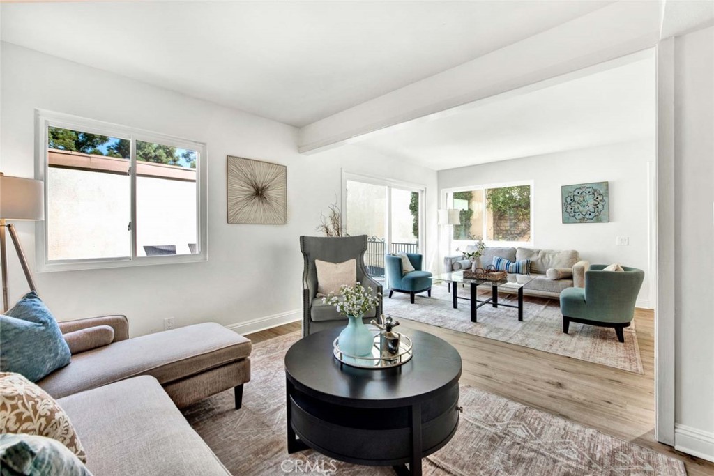 60 Willow Tree Lane Irvine, CA 92612 - Photo 12 of 74 a living room with furniture and a wooden floor