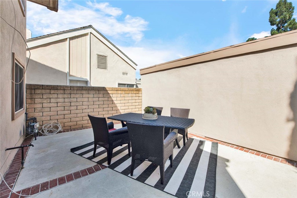 60 Willow Tree Lane Irvine, CA 92612 - Photo 15 of 74 a backyard of a house with table and chairs