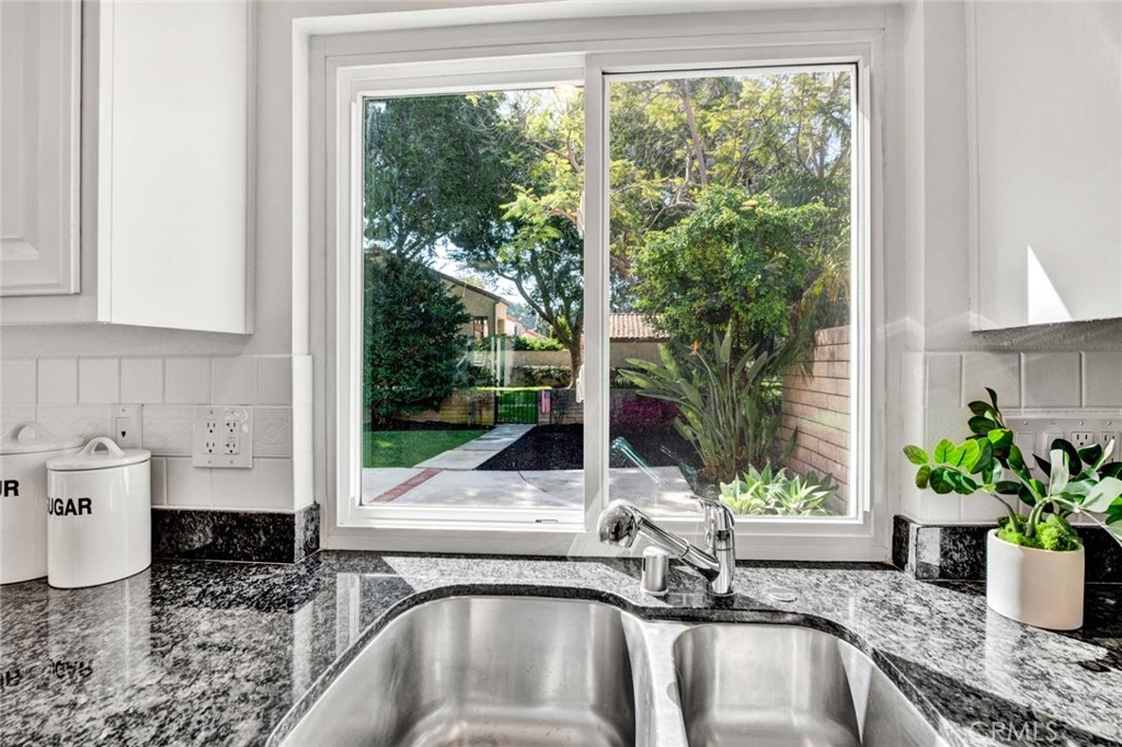 60 Willow Tree Lane Irvine, CA 92612 - Photo 20 of 74 a kitchen with a sink and a window